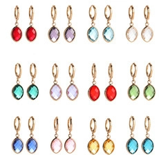 Detailed grid view of 12 pairs of gold hoop earrings with colorful rhombus stone pendants