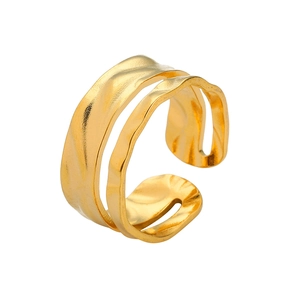Detail of gold-plated stainless steel ring featuring irregular hammered texture and open band