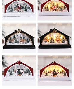 Macro view of Christmas LED lanterns showing illuminated Santa and reindeer forest scenes