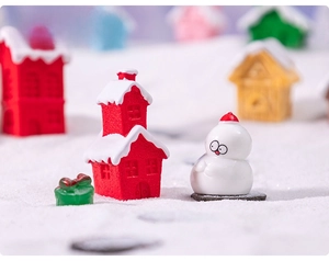 Miniature Christmas set with red snowy cabin, white snowman and green gift box