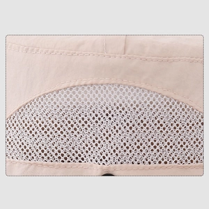 Close-up of beige breathable mesh and quick-dry fabric stitching on outdoor sun hat