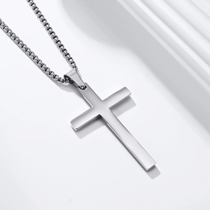Minimalist silver stainless steel cross pendant necklace with a polished metallic finish