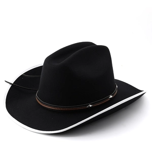 Detail of black wool cowboy hat featuring white contrast binding and studded leather band