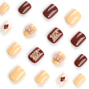 Brown and cream press on nails with 3D teddy bear, bow accents and geometric patterns