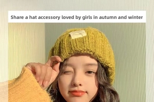 Detailed knit texture and white fabric label on a mustard yellow winter beanie hat