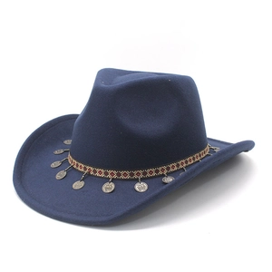 Detail of dark blue felt cowboy hat with ethnic woven band and vintage metal coin charms
