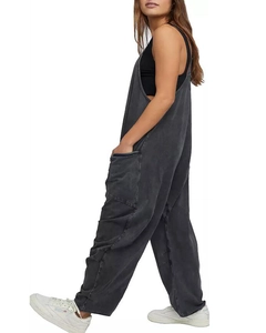 Side view of dark gray cotton wide-leg jumpsuit with large pockets and a relaxed silhouette