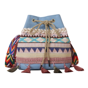 Ethnic style blue canvas bucket bag with embroidery, tassel fringe and woven strap