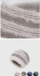 Detail of warm striped knit beanie with plush texture and soft joyload brand label
