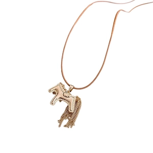 Rose gold horse pendant necklace with metal tassels on a clean white background
