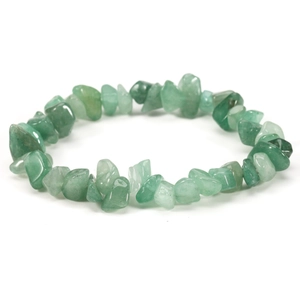 Macro shot of natural irregular green stone beads with elastic cord on white background