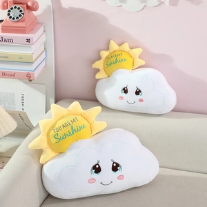 Plush sun and cloud pillows with embroidery on a sofa, cozy nursery decorative toys