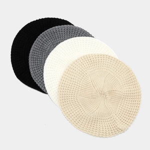 Minimalist knit beret hat in black grey white and beige colors for women in autumn and winter