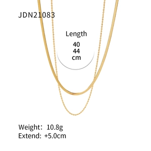 Double layered gold stainless steel necklace with snake and twist chain design