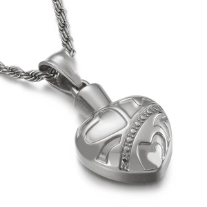Vintage stainless steel heart pendant necklace with rope chain on white background
