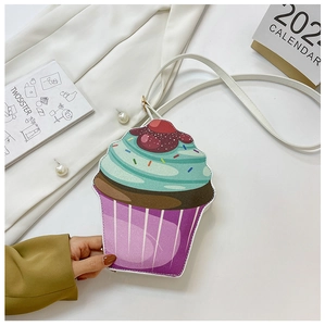 Creative cupcake-shaped crossbody bag with mint green cream top and red cherry detail