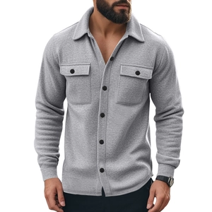 Detail of grey fleece-lined overshirt showing chest pockets and textured fabric