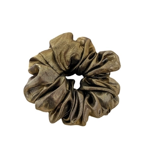 Golden bronze metallic fabric scrunchie with pleated texture on white background