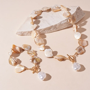 Bohemian shell and pearl necklace set with gold toggle clasp and baroque pearl pendant