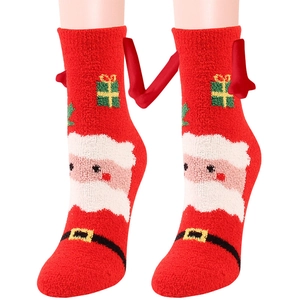 Calze natalizie in pile corallo con Babbo Natale e mani magnetiche che si tengono
