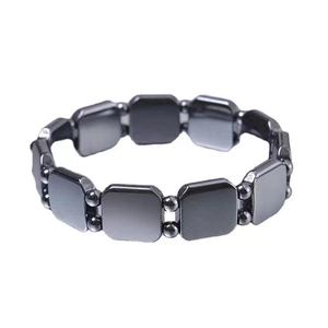 Detail of magnetic hematite stretch bracelet with black metallic rectangular beads