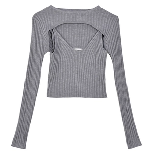 Detail of grey ribbed knit texture on the V-neck camisole and long sleeve shrug set
