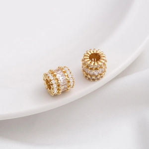 Macro detail of 14K gold plated bead spacers with micro-paved cubic zirconia stones