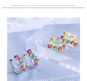 Macro shot of silver and gold huggie earrings with colorful round-cut rainbow gemstones