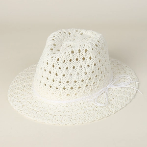 Detail view of the hollow crochet weave pattern and white bow on this straw jazz hat