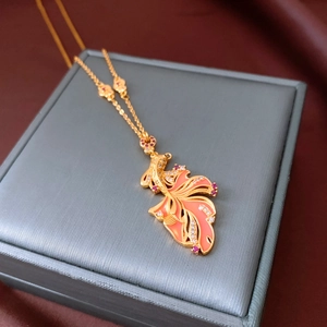 Detailed view of 24K gold plated carp pendant necklace with enamel and cubic zirconia