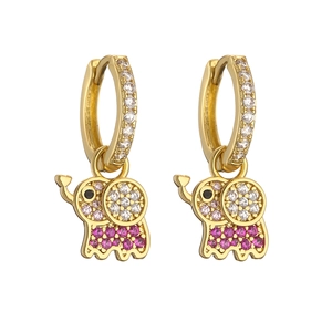 Detail of gold hoop earrings with cute elephant charms and pink sparkling stones