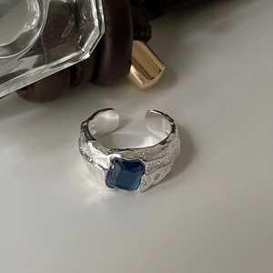 Minimalist S925 sterling silver ring with irregular hammered texture and blue gemstone
