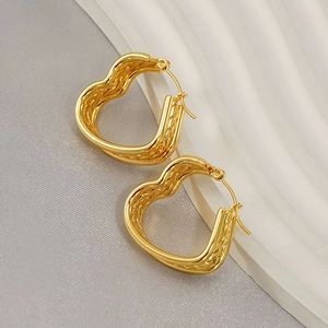 Elegant gold heart-shaped hoop earrings with a twisted multi-layer texture design