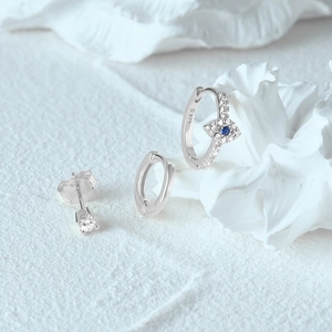 Detailed close-up of S925 sterling silver earrings set showing the engraved S925 hallmark