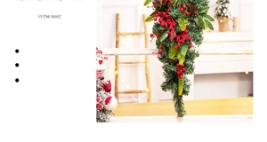 Close-up of artificial pine needles, red berries, and pinecones for Christmas decor