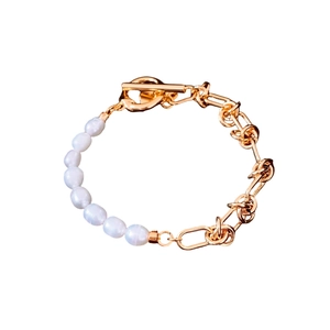 18k gold plated asymmetrical pearl chain bracelet with T-bar clasp on white background
