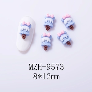 Macro shot of 3D ice cream cone nail charms with bows for colorful manicure decor