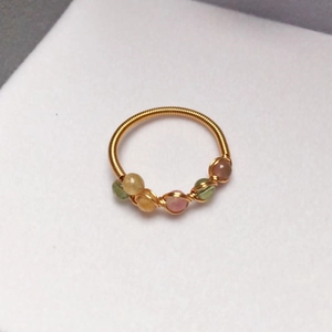 Detail of 14K gold-filled wire-wrapped ring featuring five colorful tourmaline beads