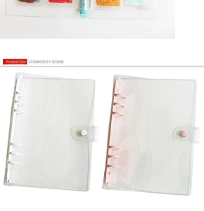 Transparent 6-ring PVC binder covers in pink and white with secure snap button closure