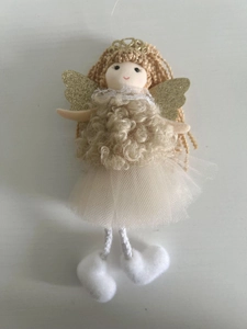 Detail view of handmade Christmas angel ornament with gold glitter wings and lace dress