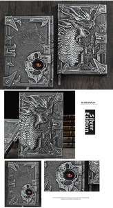 Close-up of silver 3D embossed dragon and castle on a vintage A5 fantasy notebook