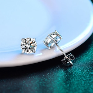 Macro shot of 925 sterling silver stud earrings with sparkling round moissanite stones