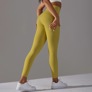 Detail of high waisted olive green yoga pants with a peach lift design and soft fabric