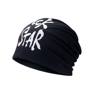Black beanie with white ROCK STAR print in a stylish street style for men and women