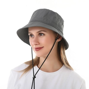 Detail of dark grey sun hat with adjustable chin strap and stitching on the brim