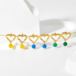 Hammered gold heart earrings with colorful bead charms in yellow, blue, and green