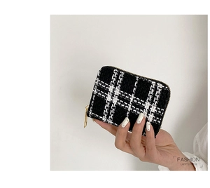 Detail of tweed woven mini wallet with gold zipper and fashion lady's purse texture