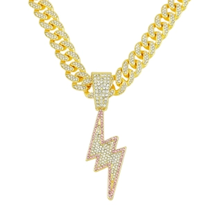 Gold Cuban chain necklace with pink and clear rhinestone lightning bolt pendant