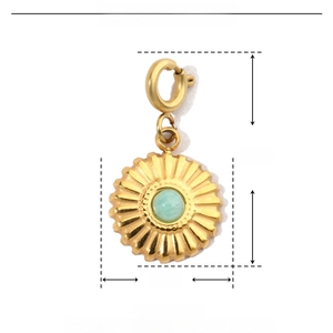 Detail view of 10mm gold sunflower pendant with light green stone and size dimensions