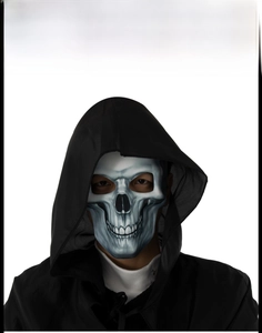 Detailed view of scary Halloween skull mask with a black hooded cloak for cosplay